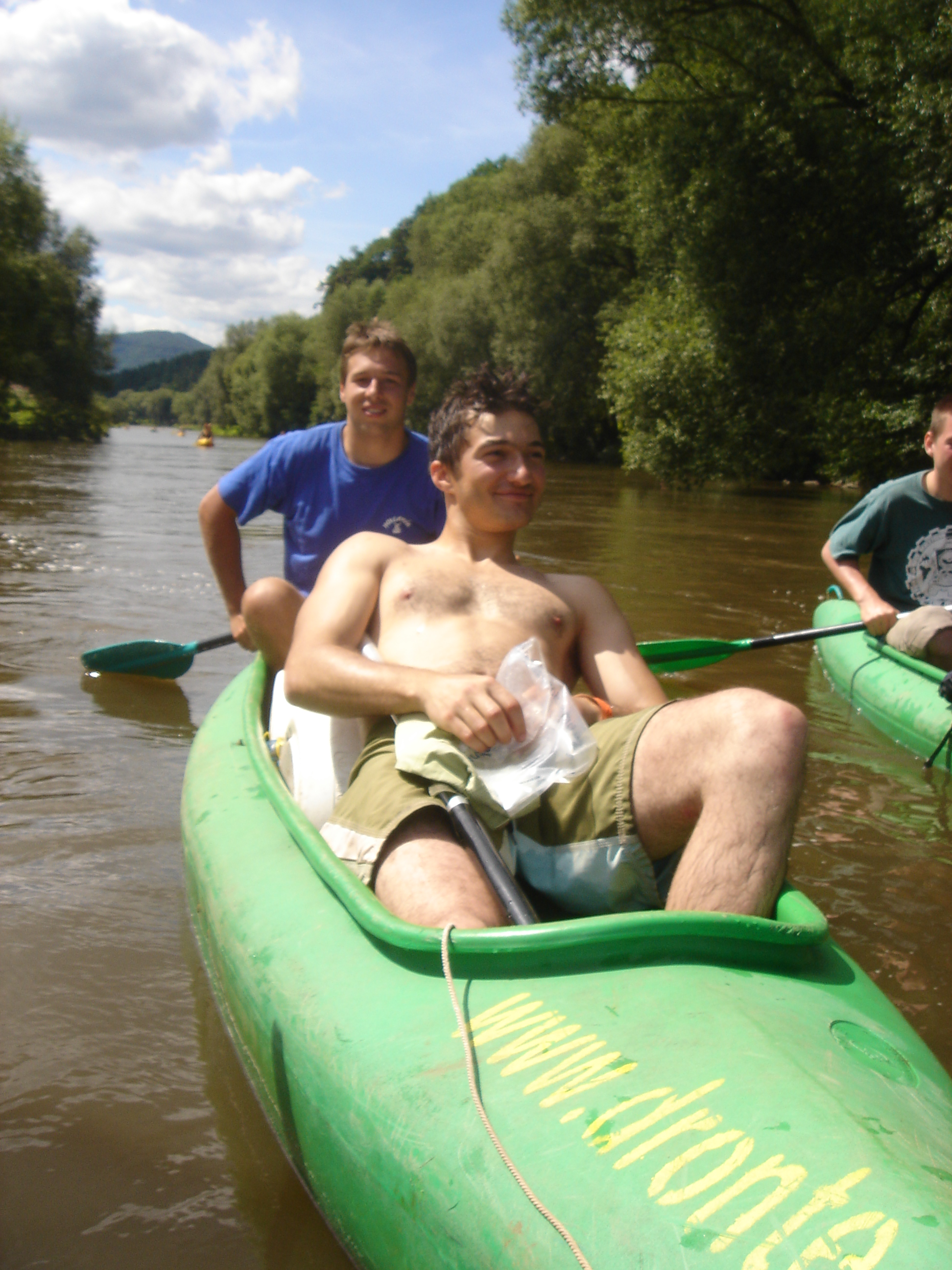 Canoeing down a Czech river with friends